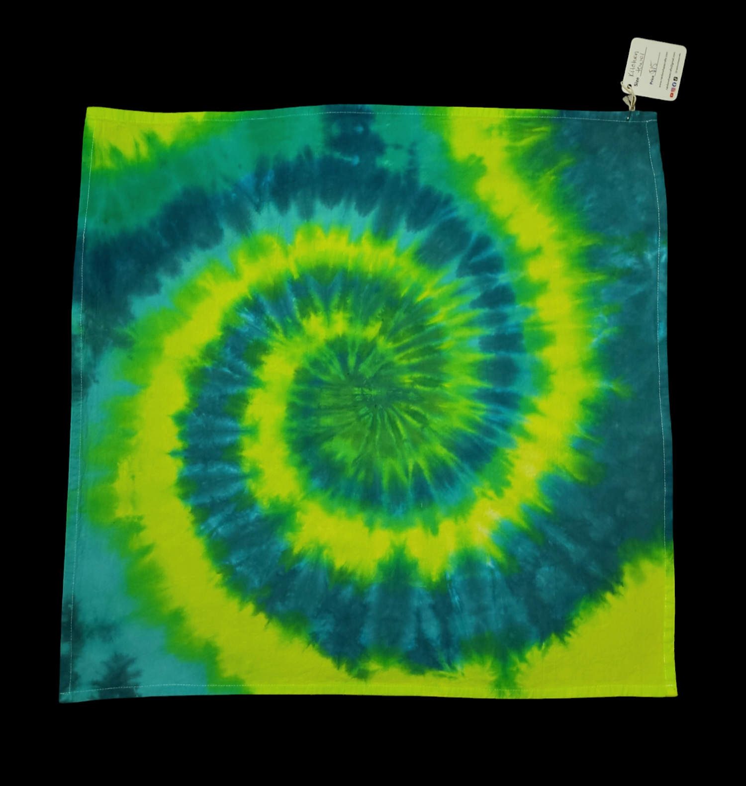 Square kitchen towel tie-dyed in a spiral design of bright lime greens and teal blues.