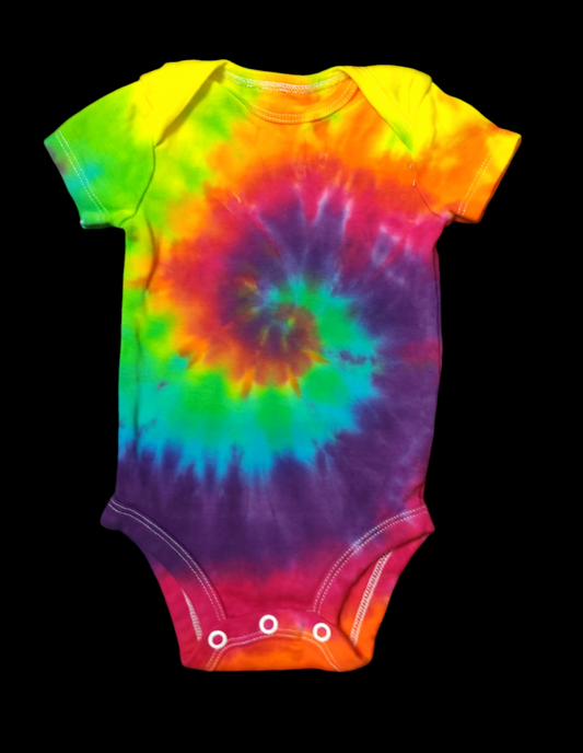 Front view of onesie for babies 0-3 months. Spiral design in bright rainbow hues in the center of the piece.