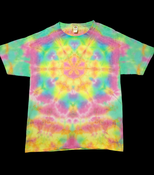 Front view of shirt with tie-dye geometric mandala in the center, in a soft rainbow of blues, greens, pinks, oranges, and yellows.